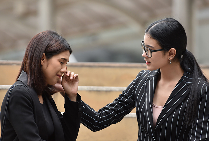 Women comforting her friend talking about suicide