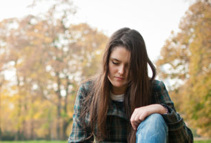 Women sat in a field recovering from a suicide attempt