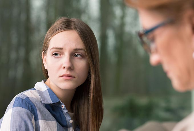 Women looking into the distance thinking about suicide ending her life