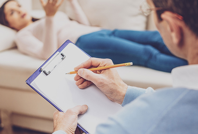 Health professional completing a risk assessment with patient
