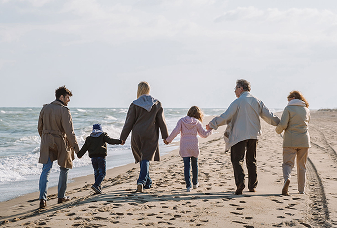 family communication - family walking along a beach