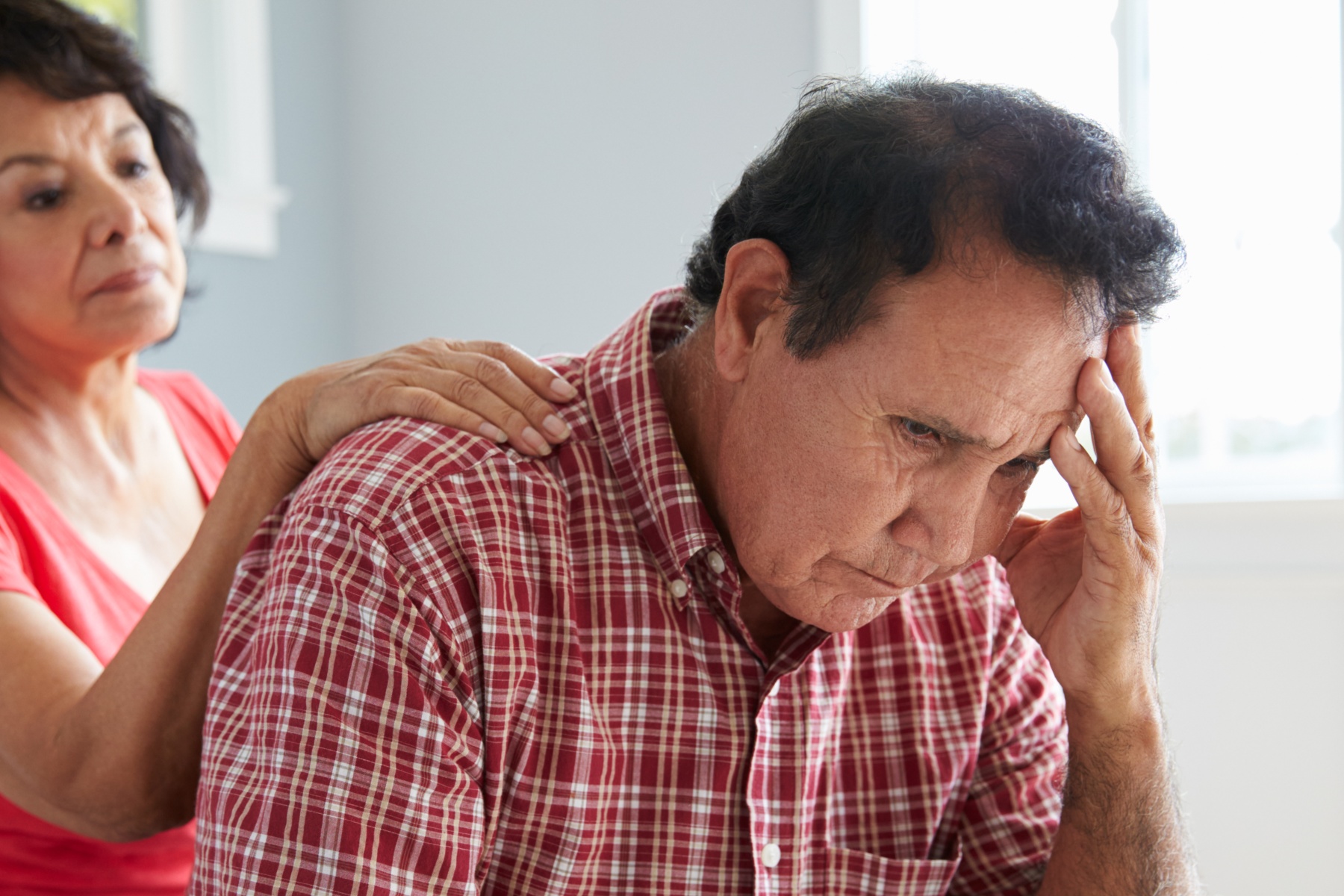 Woman comforting man