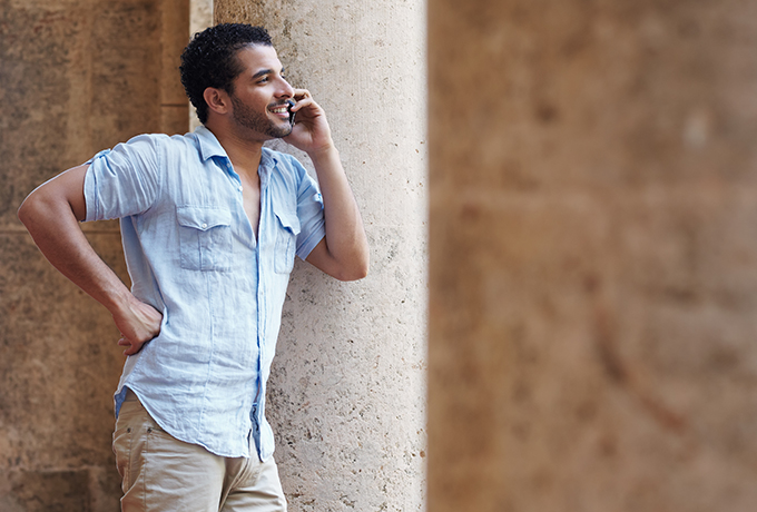 Man on phone talking with friends